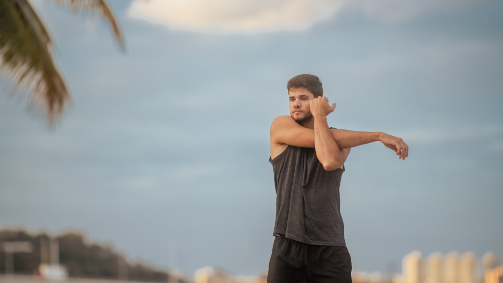 Athletic shoulder stretch targeting tight muscles and restricted range of motion from shoulder impingement