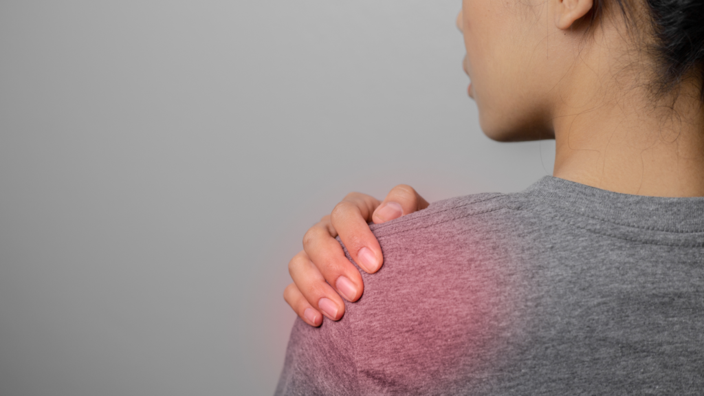 Close-up of shoulder pain commonly associated with shoulder impingement and rotator cuff strain