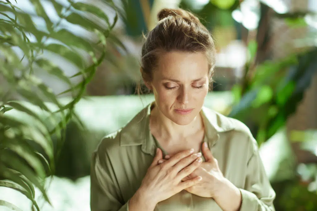 Woman practicing mindfulness and holistic wellness for stress and pain management
