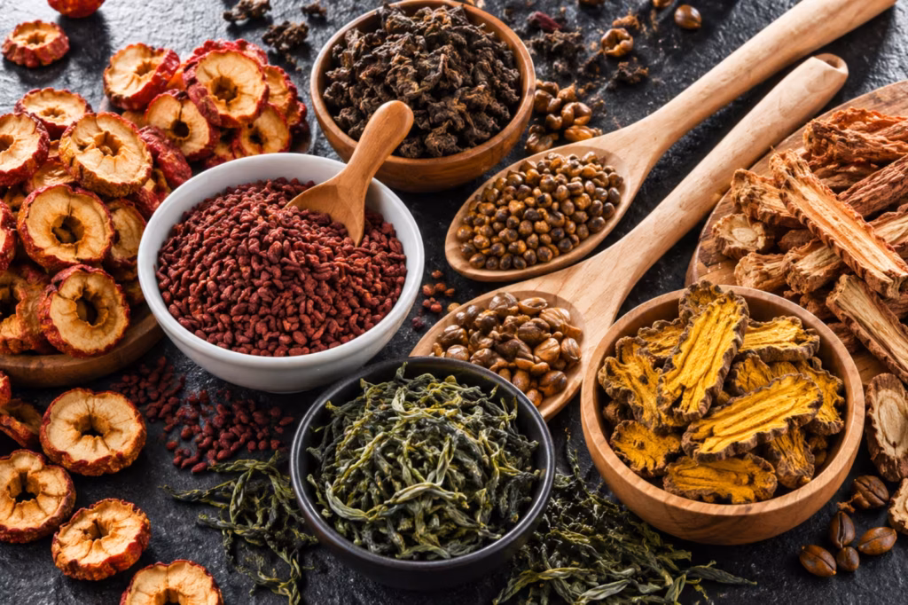 Traditional Chinese herbs for high cholesterol, including hawthorn fruit, red yeast rice, coptis root, Dan Shen, cassia seeds, and tea leaves_converted